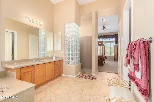 bathroom featuring tile patterned floors, ceiling fan, and vanity