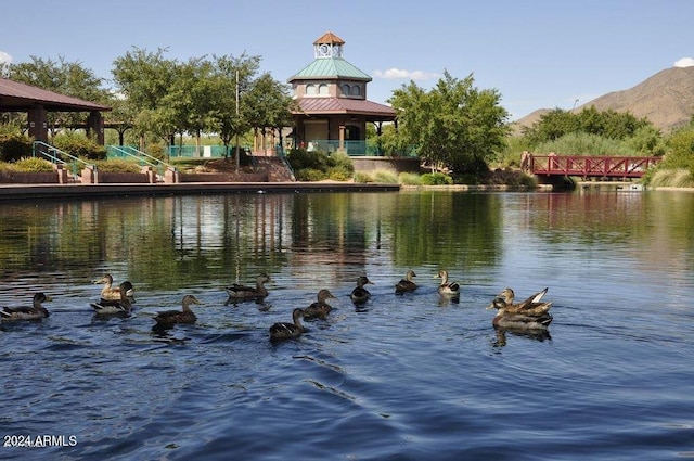 view of water feature with a gazebo and a mountain view