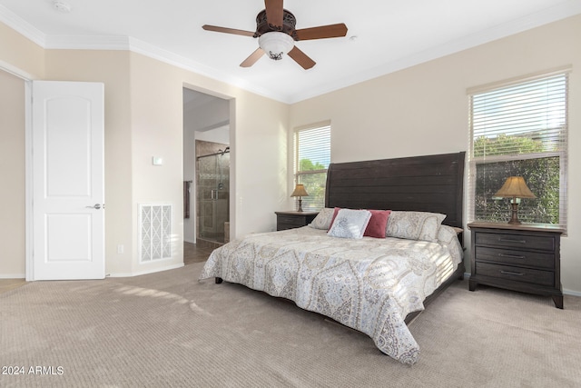 carpeted bedroom featuring ceiling fan, ornamental molding, and connected bathroom