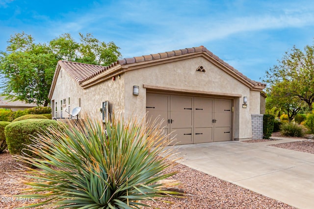 view of side of property featuring a garage