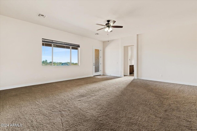 empty room with carpet flooring and ceiling fan