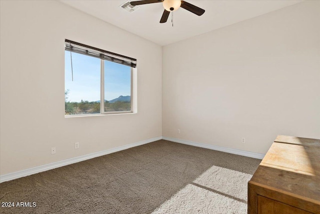 unfurnished room featuring carpet and ceiling fan