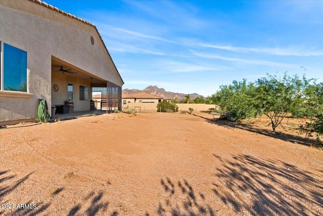 view of yard with a mountain view and a patio area