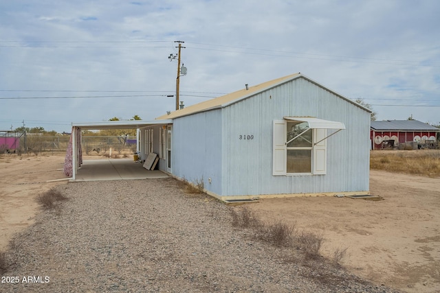 view of outdoor structure with a carport