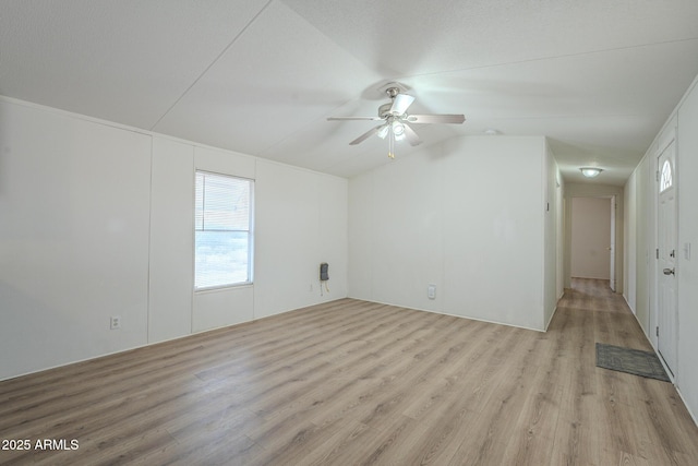 unfurnished room with light wood-type flooring and ceiling fan