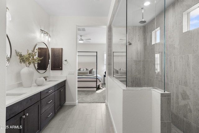 full bathroom with ensuite bathroom, a walk in shower, a sink, and visible vents