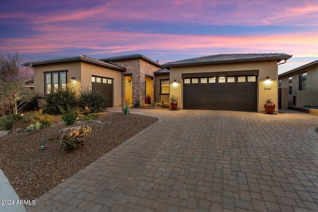 prairie-style house featuring a garage