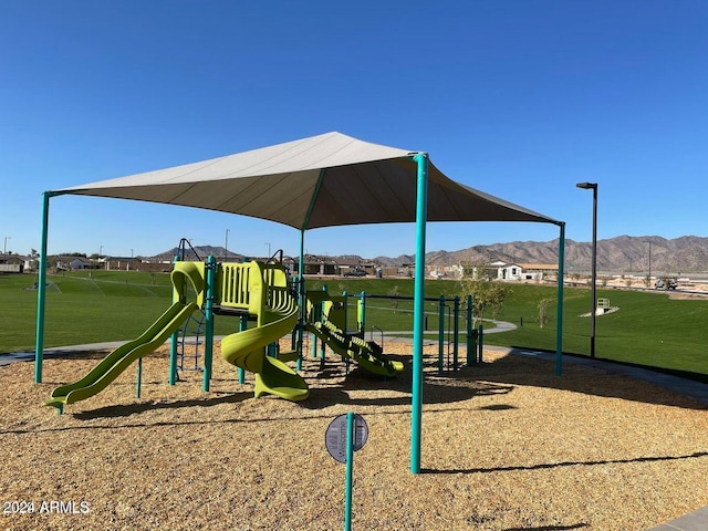 view of playground featuring a mountain view