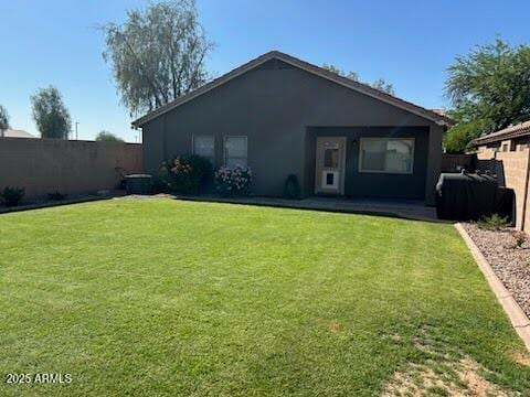 29954 N Broken Shale Dr, San Tan Valley, AZ 85143 - back of house with a fenced backyard, stucco siding, and a patio area