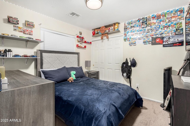 bedroom with carpet, visible vents, and baseboards