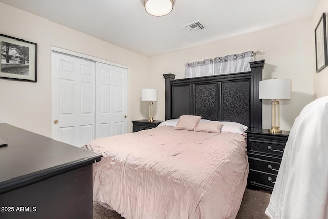 bedroom featuring carpet floors, a closet, and visible vents