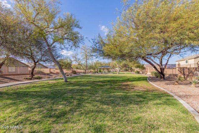 view of yard with fence and a gazebo