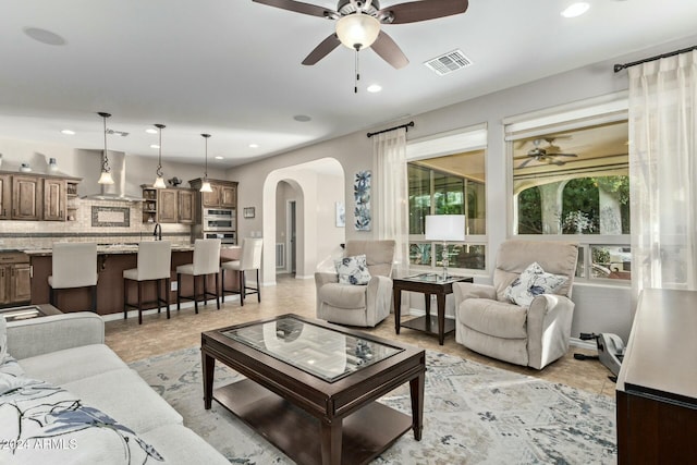 living room featuring ceiling fan