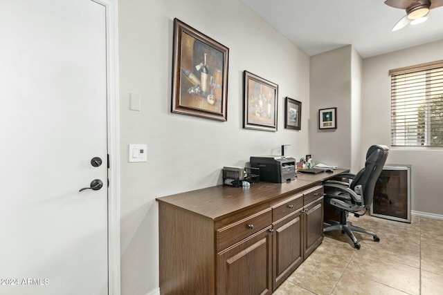 tiled office space featuring ceiling fan