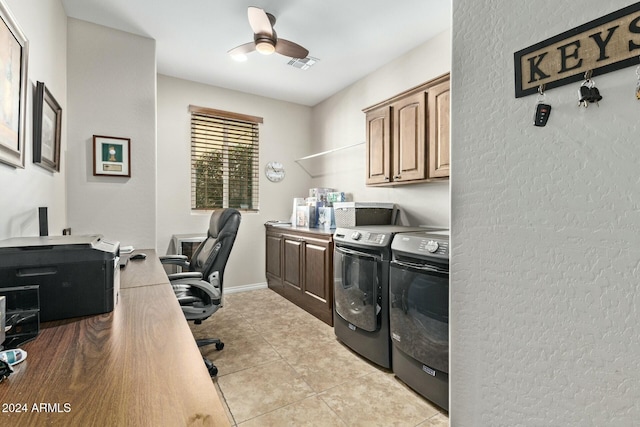 laundry area with ceiling fan, washer and clothes dryer, light tile patterned floors, and cabinets