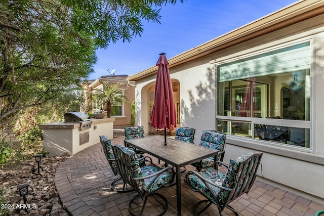 view of patio / terrace with an outdoor kitchen and area for grilling