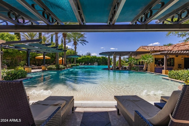 view of pool featuring a pergola and pool water feature