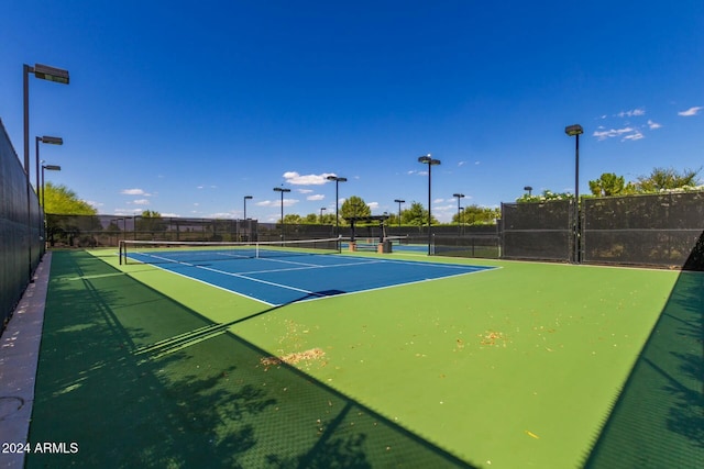 view of sport court with basketball hoop