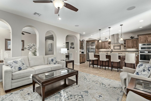 living room with ceiling fan