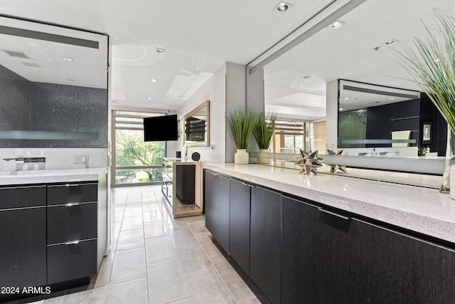 kitchen with light stone countertops and light tile patterned floors