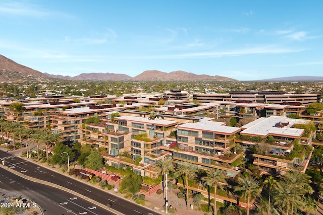 birds eye view of property featuring a mountain view