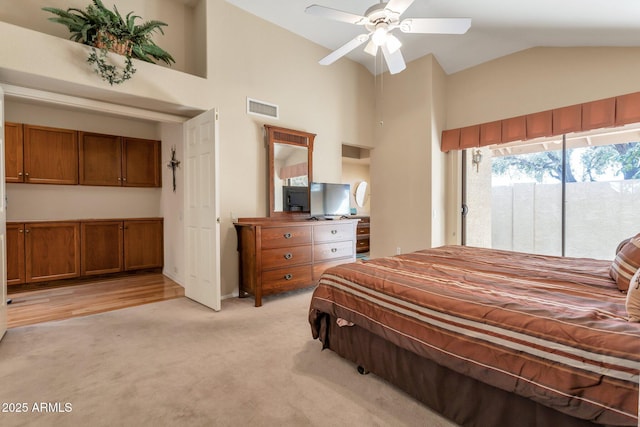 carpeted bedroom with ceiling fan, high vaulted ceiling, and access to outside