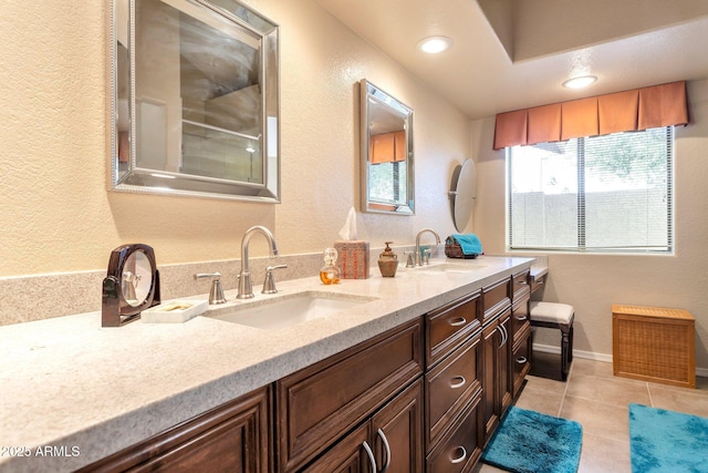 bathroom featuring tile patterned floors and vanity