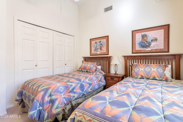 carpeted bedroom with a closet