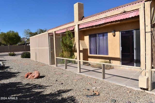 4901 E Magic Stone Dr, Phoenix, AZ 85044 - view of side of property with a chimney and metal roof