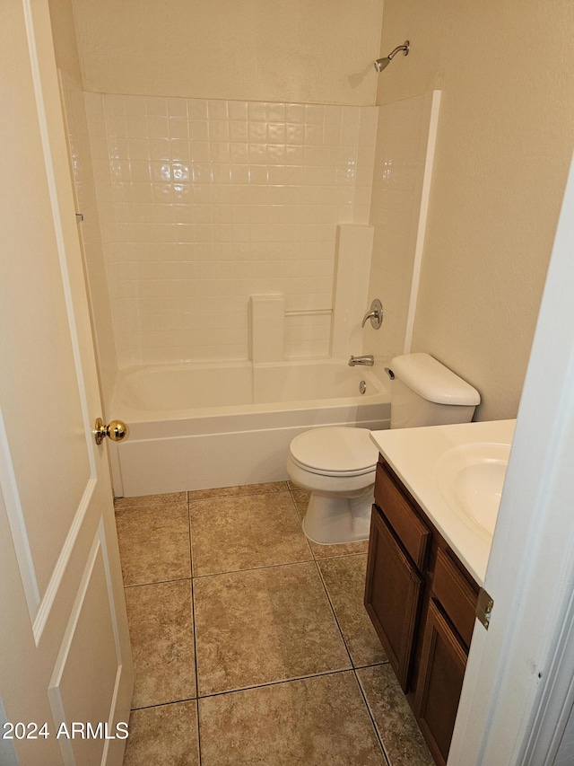 full bathroom with tile patterned flooring, vanity,  shower combination, and toilet