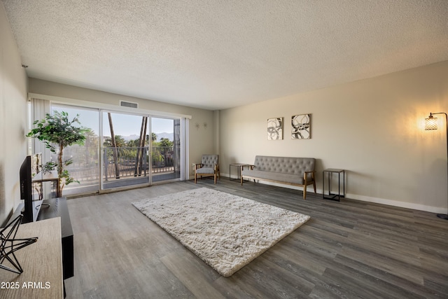 425 W Paseo Redondo Unit 6A, Tucson, AZ 85701 - living room with a textured ceiling and wood finished floors