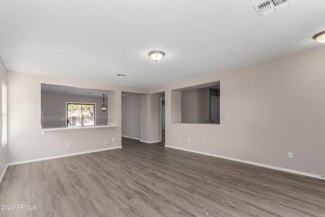 spare room with hardwood / wood-style floors