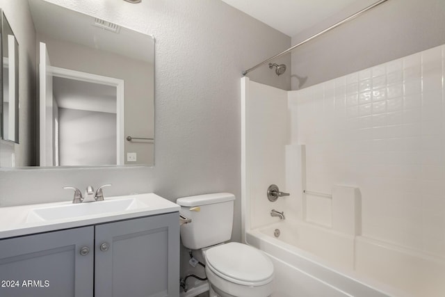 bathroom with visible vents, shower / washtub combination, vanity, and toilet