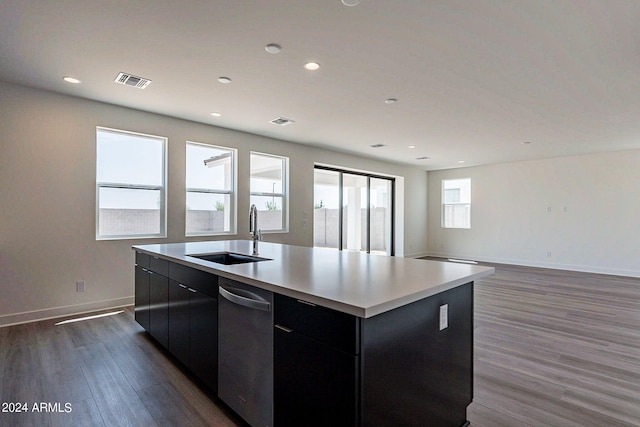 kitchen with a kitchen island with sink, sink, and dark hardwood / wood-style flooring