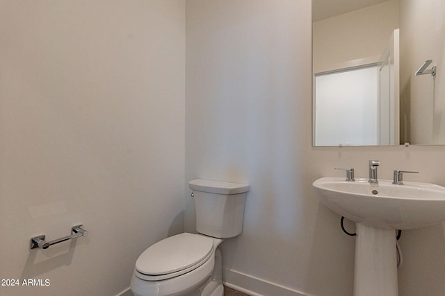 bathroom with toilet and sink