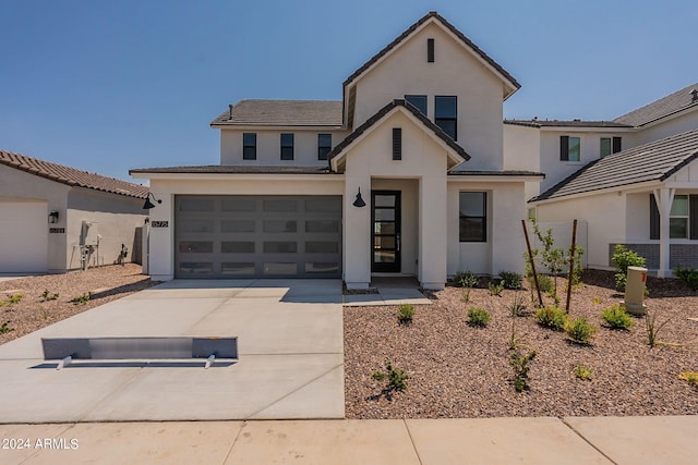 view of front of property with a garage