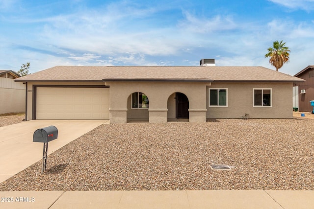 2210 W Tonto Ln, Phoenix, AZ 85027 - ranch-style house with concrete driveway, an attached garage, and stucco siding
