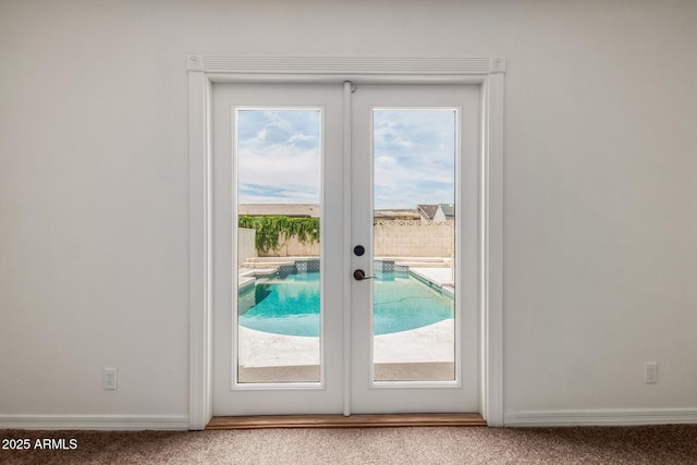 2210 W Tonto Ln, Phoenix, AZ 85027 - doorway to outside featuring carpet flooring, plenty of natural light, french doors, and baseboards