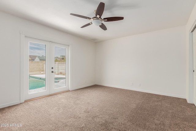 2210 W Tonto Ln, Phoenix, AZ 85027 - carpeted empty room with french doors, a ceiling fan, and baseboards