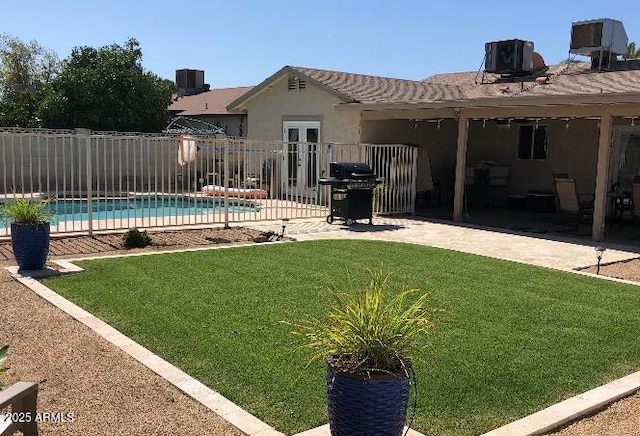 2210 W Tonto Ln, Phoenix, AZ 85027 - view of swimming pool with area for grilling, central air condition unit, and a patio