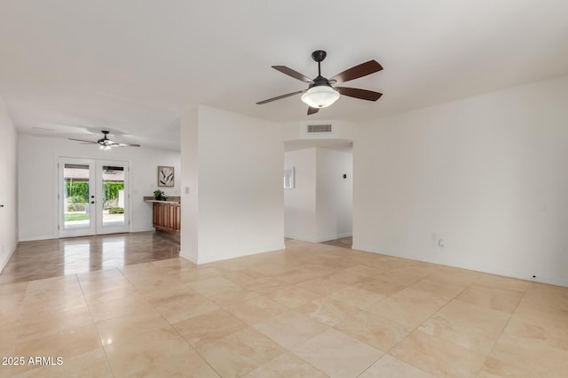2210 W Tonto Ln, Phoenix, AZ 85027 - spare room with a ceiling fan, french doors, and light tile patterned flooring