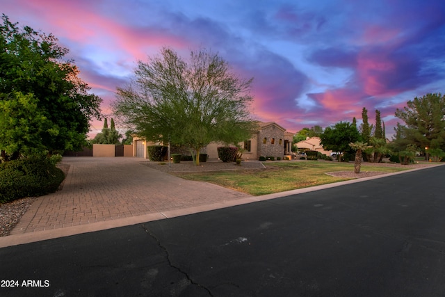 view of front of property with a yard