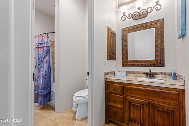 full bathroom with tile patterned flooring, vanity, shower / bath combo, and toilet