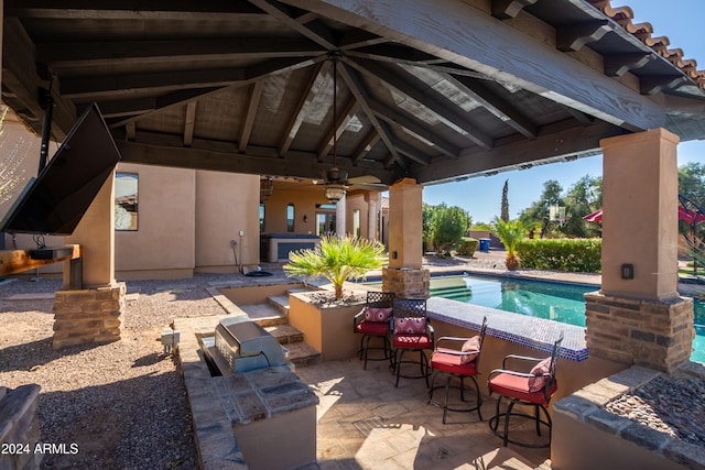 view of swimming pool featuring a gazebo, an outdoor bar, ceiling fan, and a patio area