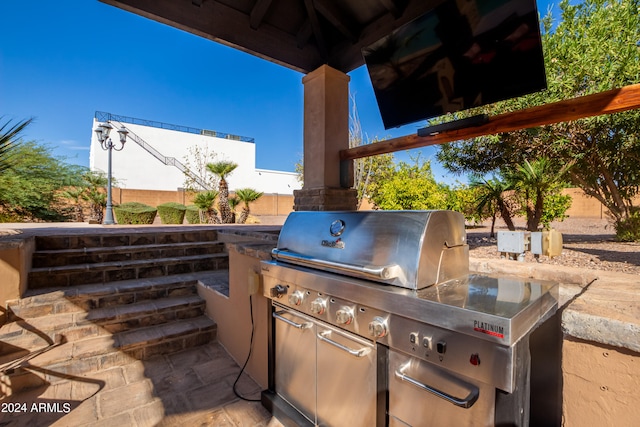 view of patio / terrace with a grill and an outdoor kitchen