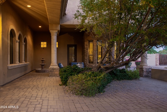 entrance to property featuring a patio area