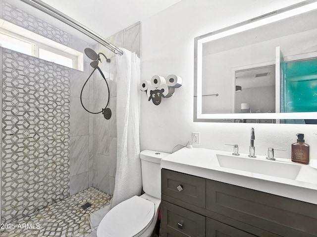 4639 W Keim Dr, Glendale, AZ 85301 - bathroom featuring tiled shower, toilet, and vanity