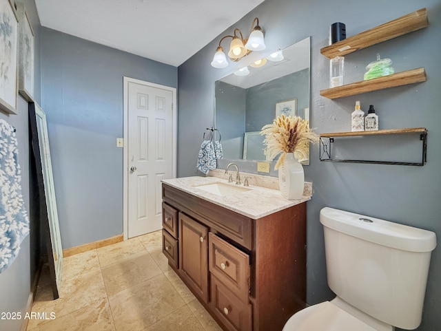 4639 W Keim Dr, Glendale, AZ 85301 - bathroom featuring vanity, toilet, baseboards, and tile patterned floors