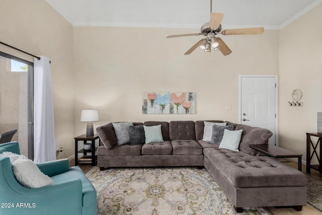 living room with ceiling fan and crown molding