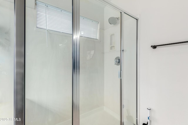 full bathroom featuring a stall shower